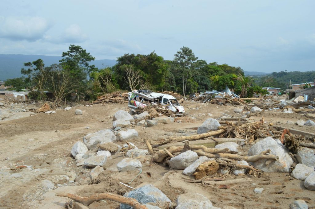 Devastation in Mocoa, Colombia with debris and wreckage from a recent natural disaster.