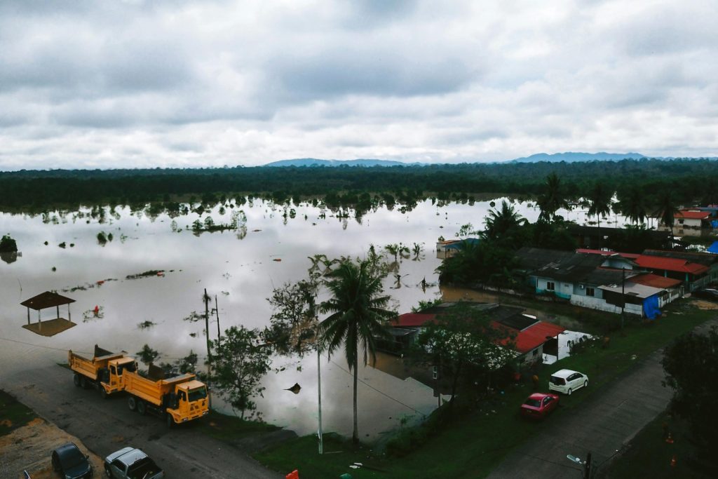 Aerial view of a flooding landscape in Kijal, Terengganu, Malaysia, illustrating the impact of natural disasters.